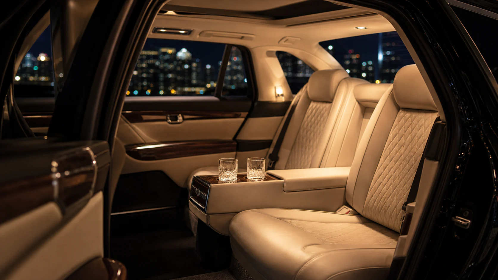 Cream leather and dark wood inside an Aureline luxury vehicle